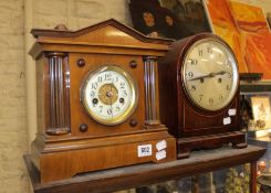 An early 20th century Constantia mantel clock, the silvered dial in arched mahogany case, 29cm high,