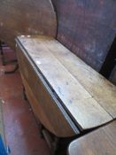 An 18th century oak gateleg table and a 19th century oak corner cupboard