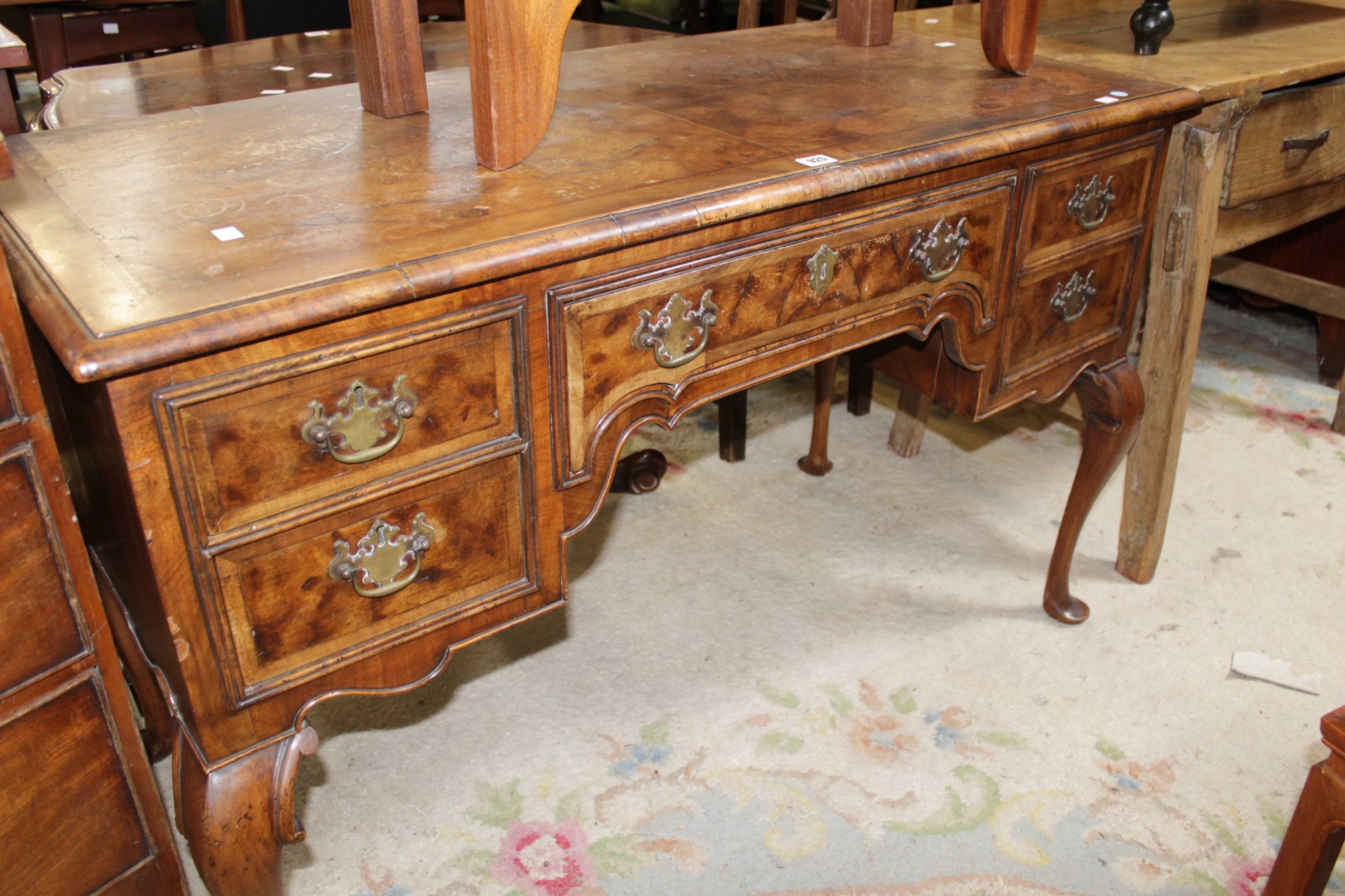 An early 20th century walnut and crossbanded dressing table with cabriole legs 125cm wide