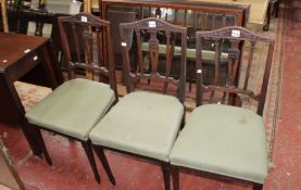 A set of four George III style mahogany dining chairs with classical design splat back and