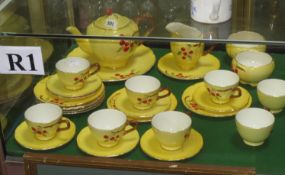 A yellow ground Royal Winton part tea service decorated with cherries