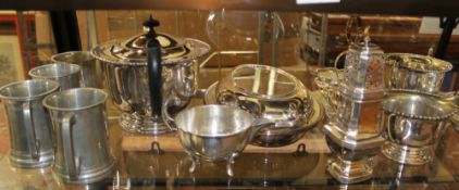 A collection of plated wares including entree dishes, a sugar shaker and a pair of bottle coasters