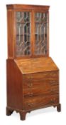 A George III mahogany bureau bookcase, circa 1780, moulded cornice, a pair of astragal glazed doors,