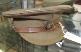 Hertfordshire Regiment - A Great War Peaked Service Cap, bearing the badge of the regiment, complete