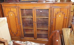 An Edwardian mahogany dwarf side cabinet with brass gallery back to the top enclosed by a pair of
