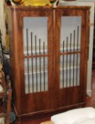 A Beidermeier style mahogany glazed cupboard 176cm high, 123cm wide