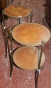 A pair of brass and leather fitted circular stands and a glass and gilt metal coffee table