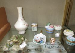 A small collection of porcelain pill boxes including two Coalport examples and Halcyon Days enamels,