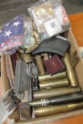 A Collection of Inert Brass Shell Cases, and military related insignia, etc.