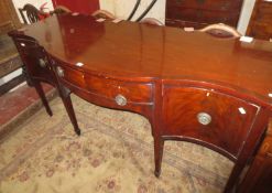 A George III style mahogany serpentine front sideboard, 19th century, with ebony stringing 180cm