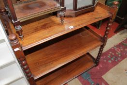 A Victorian mahogany three tier buffet, 92cm and a white painted open front bookcase, 89cm