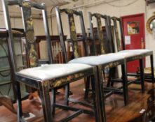 A set of four black lacquer and gilt japanned side chairs