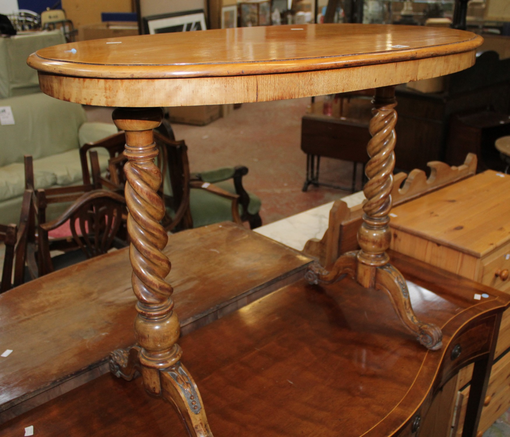 A Victorian satinwood and carved walnut oval table, 90cm length
