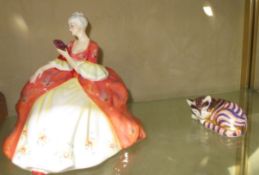 A Royal Doulton figure `Wistful` (HN 2396) and a Royal Crown Derby Imari palette recumbent cat no