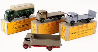 A Dinky No.511, Guy 4-Ton Lorry, first type cab, fawn with a red chassis and red ridged hubs, good