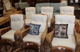 A set of six wicker and upholstered conservatory chairs, plus two tables