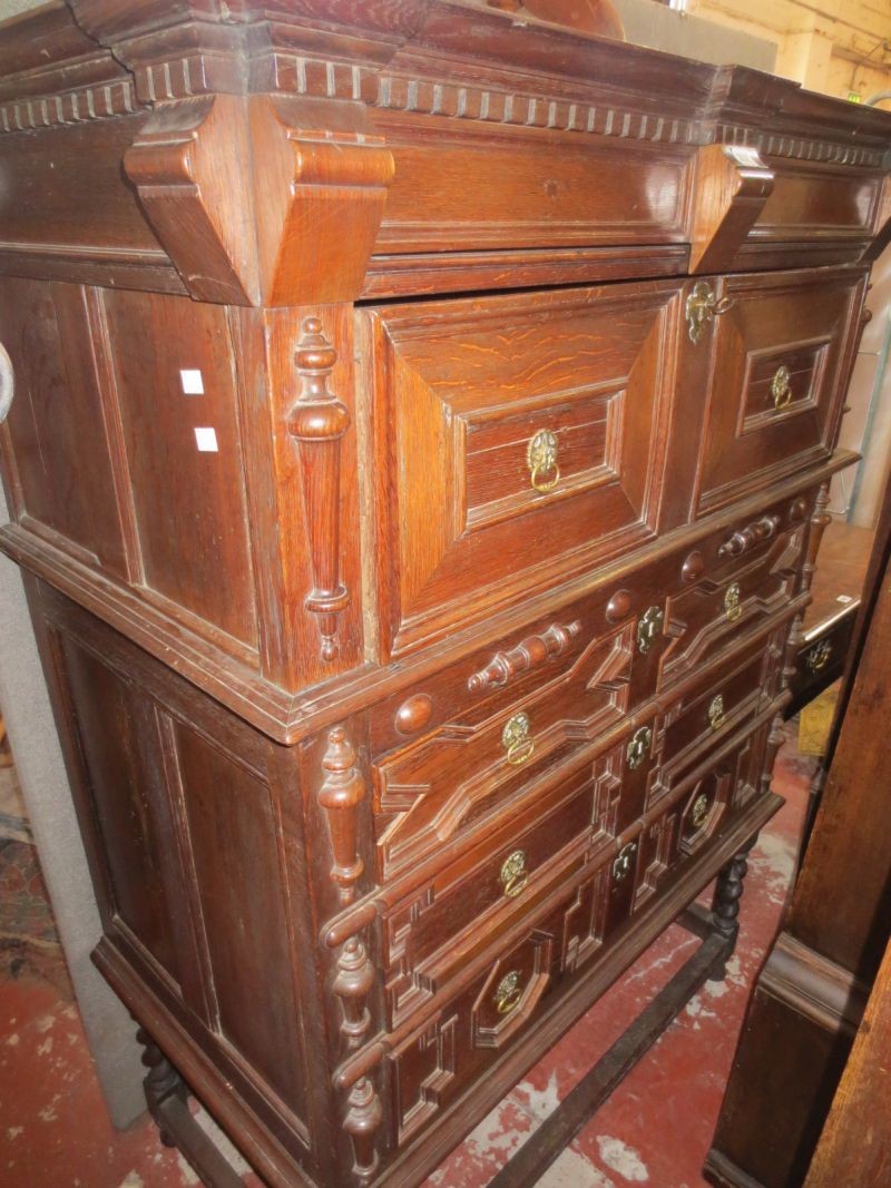 An oak chest on stand in Jacobean manner 156cm high, 114cm wide
