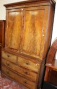 A George III Gentleman’s mahogany wardrobe the upper part enclosed by a pair of panelled doors