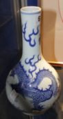 A 20th Century Chinese blue and white bottle vase decorated with a celestial dragon, Daoguang mark