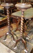 A pair of oak jardiniere stands & a leather inset mahogany coffee table