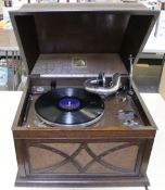 An H.M.V. No.104 table-top gramophone, with an H.M.V. No.5A reproducer, in an oak case.