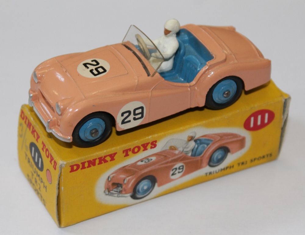 A Dinky No.111, Triumph TR2 Sports, pink, racing number `29`, mid-blue ridged hubs, near mint,