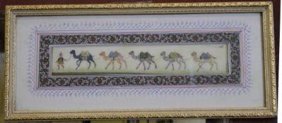 Two framed and glazed hand painted Persian ivory strips, one depicting men on horseback hunting; (