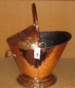 A Victorian copper coal scuttle