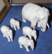 A group of five various sized carved Ivory elephants