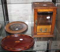 An inlaid tray with foliate design, a smokers cabinet, a reproduction oval small tray and mirrors