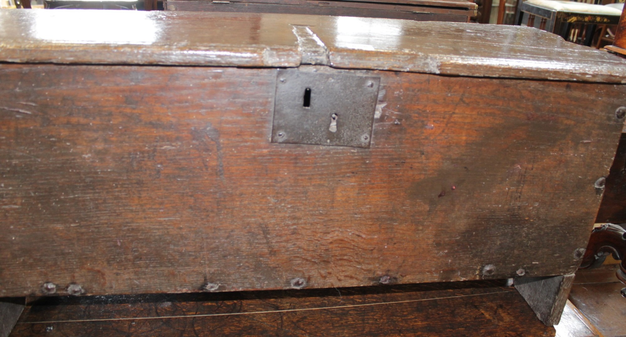 An 18th century oak boarded coffer with notched and scratch moulded decoration 97cm wide