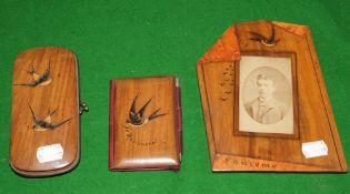 An olive wood photograph frame, notebook and cigar case, all inscribed `Sanremo`