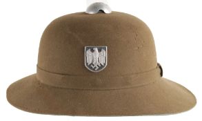 A Second World War Afrika Korps Pith Helmet, regulation pattern with metal insignia.