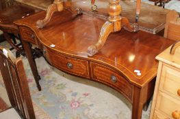 A George III style mahogany bowfront serving table 136cm wide
