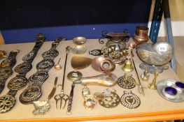A quantity of horse brasses, some on leather straps and other copper and brassware including a