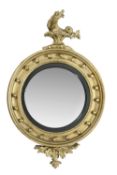 A Regency giltwood convex wall mirror, circa 1815, surmounted by a mythological creature, 95cm high,