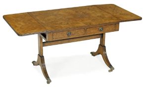 A walnut coffee table modelled as a sofa table, in George III style, late 19th or early 20th
