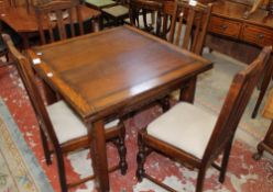 An Edwardian oak drawleaf table and a set of four dining chairs