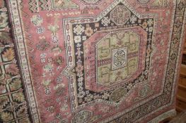 A rose ground Caucasian rug 170cm x 125cm