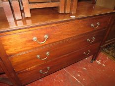 An early 20th century stained hardwood chest of drawers on straight legs with three drawers and a