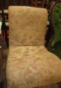 An upholstered low nursing chair, circa 1900. Two Singer sewing machine tables, early 20th