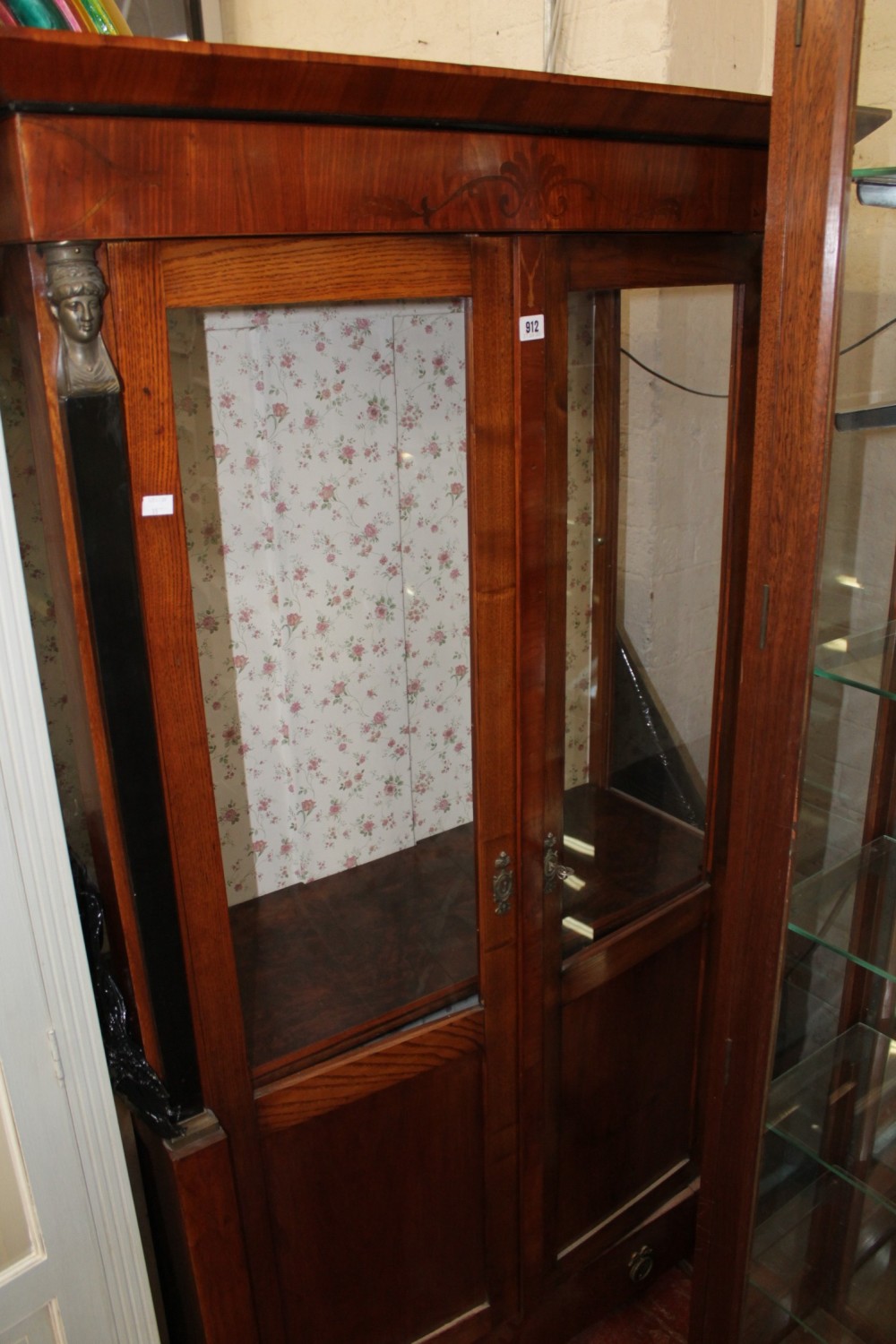 A Beidermeier style glazed cupboard 177cm high, 99cm wide