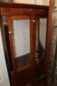 A Beidermeier style glazed cupboard 177cm high, 99cm wide