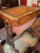 A Victorian walnut work table decorated with an ebony and line inlaid band, fitted a drawer with