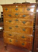 An antique walnut chest on stand fitted three short and three long drawers, the base with two