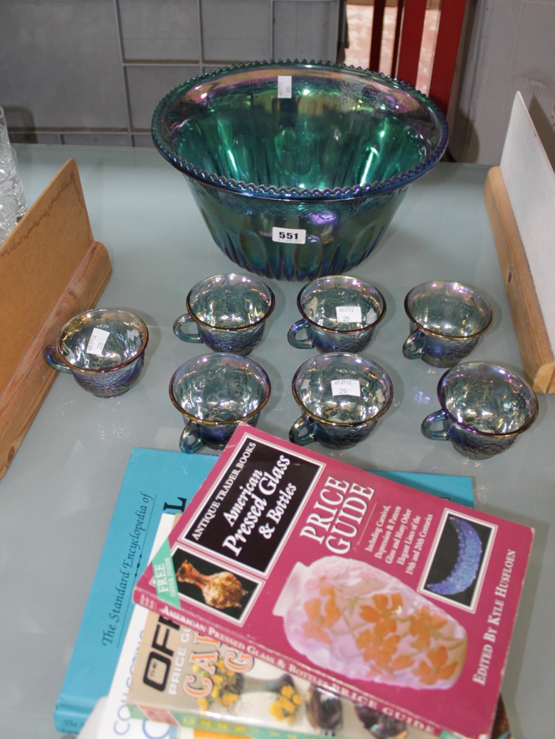 An Indiana Carnival glass punch bowl decorated with grapes together with seven cups and related