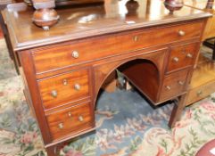 A George III style mahogany kneehole desk on square legs, 83cm high, 94cm wide, 57cm deep