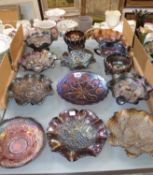 A mixed collection of carnival glass items including predominately dark coloured pie crust and