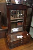 A 19th century French empire toilet mirror with architectural pediment the inlaid base fitted two