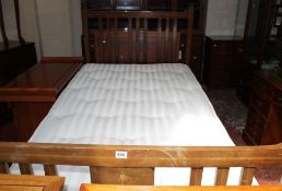 An Edwardian mahogany and inlaid bed